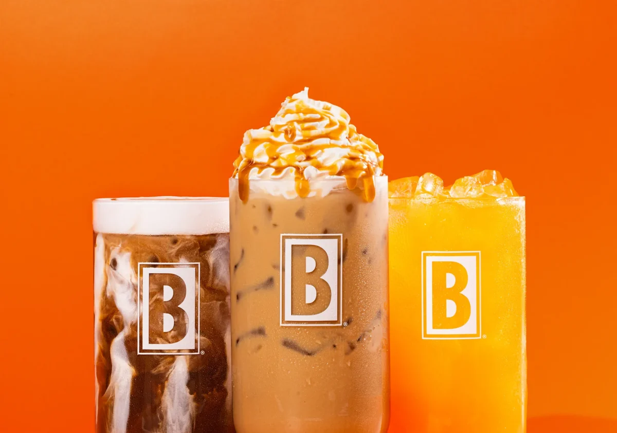 Lineup of Biggby drinks including iced coffee and a fruity drink